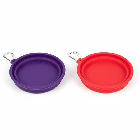 Purple and red collapsible dog travel bowls with carabiner clips on white background
